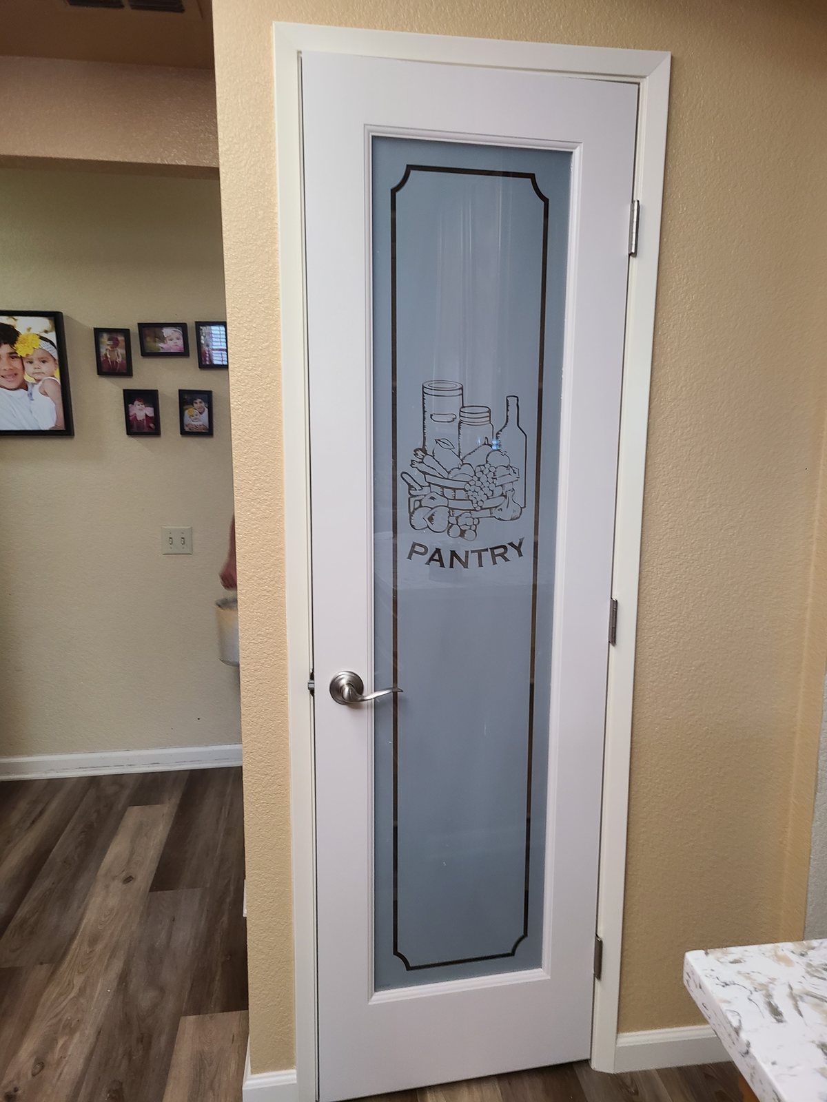 A frosted-glass pantry door
