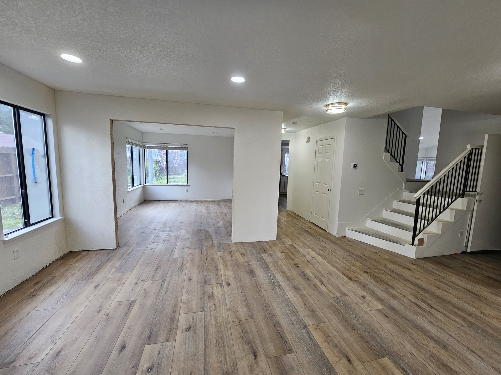 An open living area and staircase with new flooring