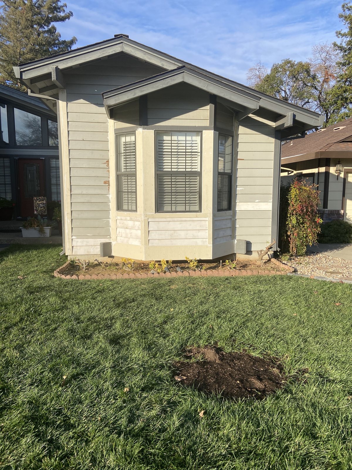 The front exterior of a single-story home and lawn