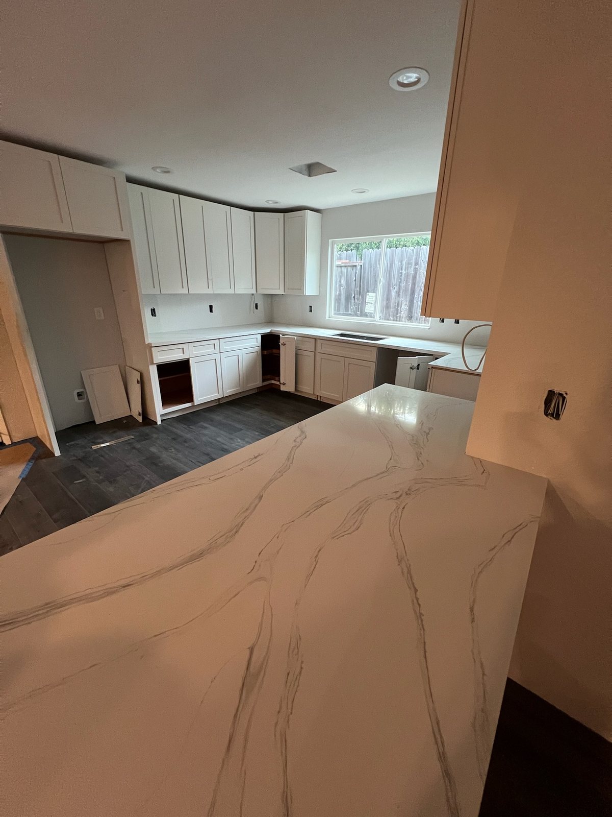 Kitchen cabinets and island during a home addition