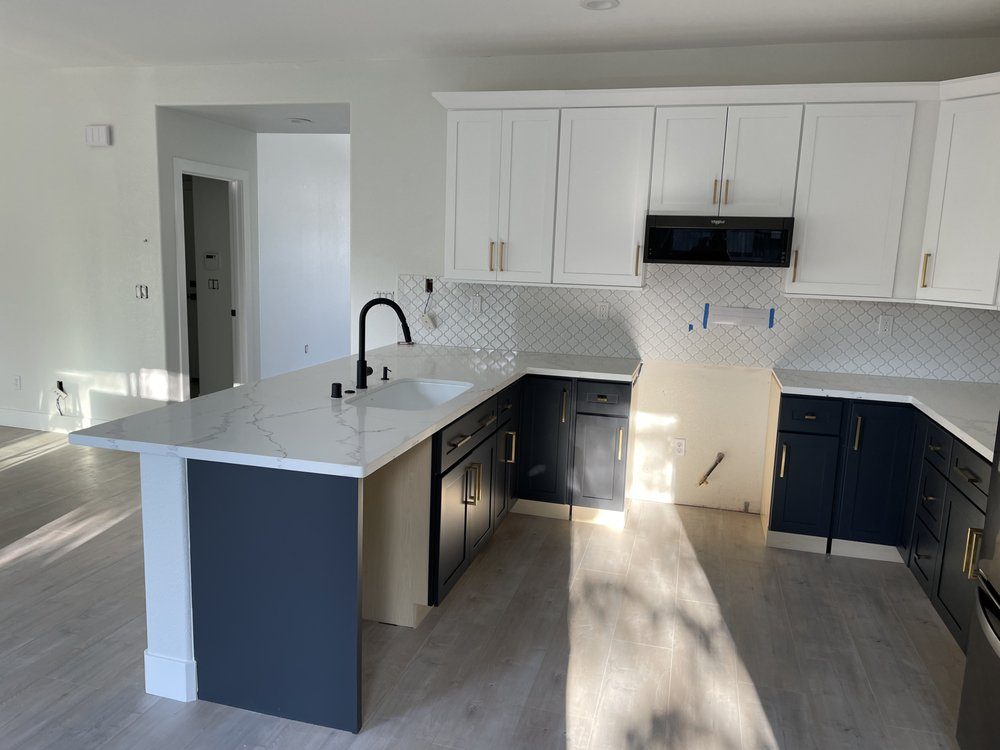 Bar-top counter lowered to standard height, new cabinets and backsplash