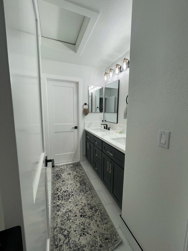 Bathroom remodel: new doors, vanity, plumbing, fixtures, paint and tile