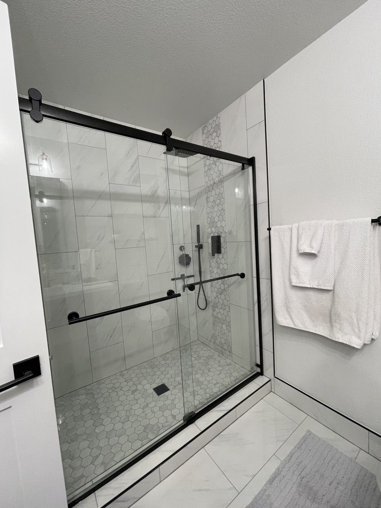 Shower upgrade: new door, plumbing and tile